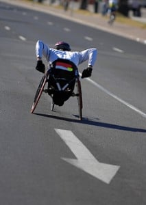Single wheelchair athlete in action during a marathon.